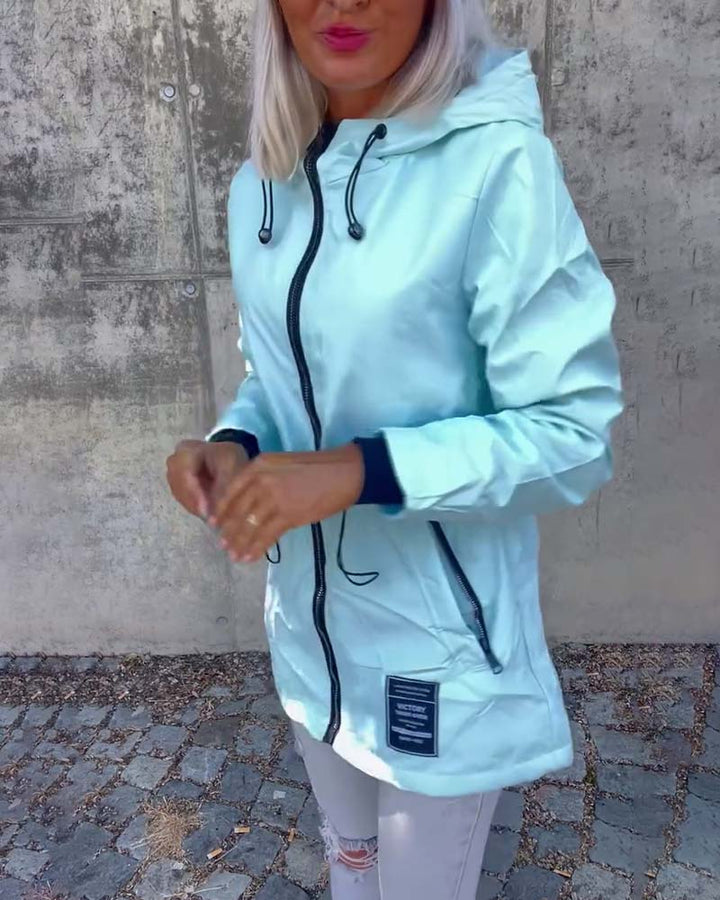 Manteau à fermeture éclair et cordon de serrage